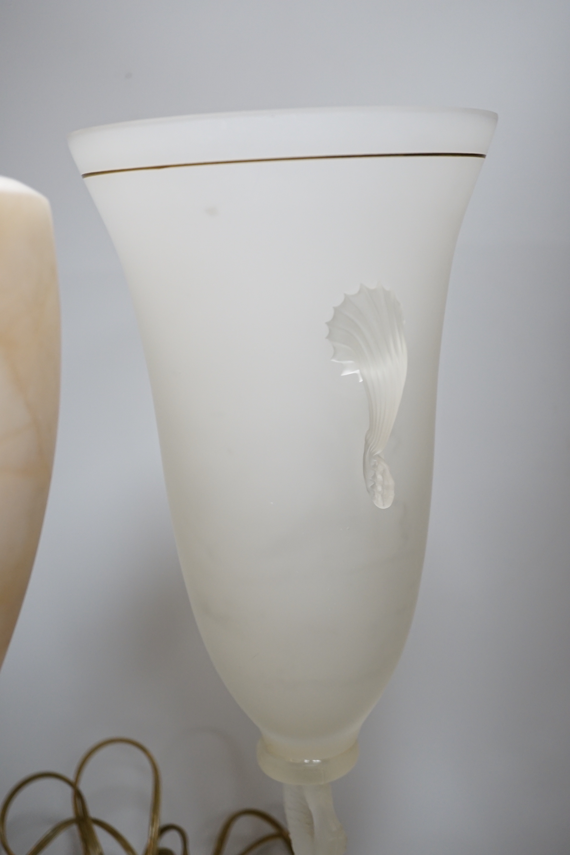 A glass uplighter table lamp in the style of alabaster and two frosted glass dolphin vases